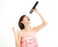 Beautiful young woman singing karaoke Royalty Free Stock Photo