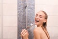 Beautiful young woman singing in shower Royalty Free Stock Photo