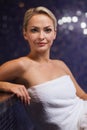 Beautiful young woman sitting in bath towel Royalty Free Stock Photo