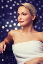 Beautiful young woman sitting in bath towel Royalty Free Stock Photo