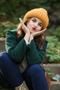 Beautiful young woman sitting on stairs outdoors Royalty Free Stock Photo