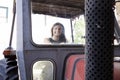 Beautiful young woman sitting on a tractor Royalty Free Stock Photo