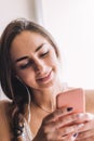 Beautiful young woman sitting on the windowsill listen to music Royalty Free Stock Photo