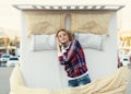 Beautiful young woman sleeping in a bed in the city center Royalty Free Stock Photo