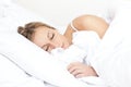 Beautiful young woman sleeping on her bed Royalty Free Stock Photo