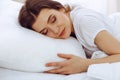 Beautiful young woman sleeping while lying in her bed. Concept of pleasant and rest reinstatement for active life Royalty Free Stock Photo