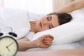 Beautiful young woman sleeping while lying in her bed. Concept of pleasant and rest reinstatement for active life Royalty Free Stock Photo