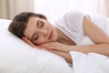 Beautiful young woman sleeping while lying in her bed. Concept of pleasant and rest reinstatement for active life Royalty Free Stock Photo