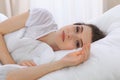 Beautiful young woman sleeping while lying in her bed and relaxing comfortably. It is easy to wake up for work or the Royalty Free Stock Photo