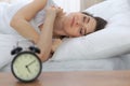 Beautiful young woman sleeping while lying in her bed and relaxing comfortably. It is easy to wake up for work or the Royalty Free Stock Photo