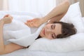 Beautiful young woman sleeping while lying in her bed and relaxing comfortably. It is easy to wake up for work or the Royalty Free Stock Photo