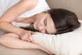 Beautiful young woman sleeping on orthopedic comfortable pillow, Royalty Free Stock Photo