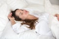 Beautiful young woman sleeping well in cozy comfortable soft bed Royalty Free Stock Photo