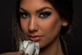 Beautiful young woman smelling a white rose closeup Royalty Free Stock Photo