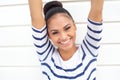 Beautiful young woman smiling with arms raised Royalty Free Stock Photo