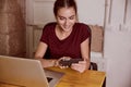 Beautiful young woman smiling at cellphone Royalty Free Stock Photo