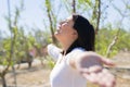 Beautiful young woman smiling cheerful with open arms and eyes closed relaxing and enjoying sunbathe in a sunny day of spring Royalty Free Stock Photo