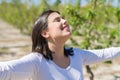 Beautiful young woman smiling cheerful with open arms and eyes closed relaxing and enjoying sunbathe in a sunny day of spring Royalty Free Stock Photo