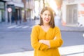 Beautiful young woman smiling cheerful walking on the street on a sunny day, casual pretty girl at the town