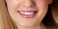 Beautiful young woman smiling. Cosmetic skin care and make-up. Dentistry. Close-up smile