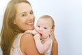 Beautiful young woman smiling with cute baby Royalty Free Stock Photo