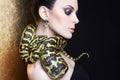 Beautiful young woman with Snake