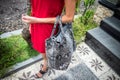 Beautiful young woman with snakeskin python leather handbag posing in sunglasses. Tropical Bali island, Indonesia. Royalty Free Stock Photo