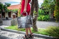 Beautiful young woman with snakeskin python leather handbag posing in sunglasses. Tropical Bali island, Indonesia. Royalty Free Stock Photo