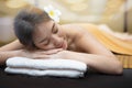 Beautiful young woman in spa salon, Body care. Spa body massage woman hands treatment. Woman having massage in the spa salon Royalty Free Stock Photo