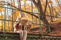 Woman reading a map while taking hiking break in the forest Royalty Free Stock Photo