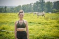 Beautiful Young Woman In Sports Bra And Leggings On Horse Farm