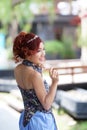 Beautiful young woman stand alone at the outdoor cafe Royalty Free Stock Photo