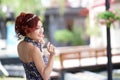 Beautiful young woman stand alone at the outdoor cafe Royalty Free Stock Photo