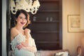 beautiful young woman standing near the door in the luxury Royalty Free Stock Photo