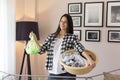 Woman holding a washbowl full of wet clothes Royalty Free Stock Photo