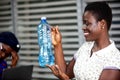 Beautiful young woman holding a bottle of mineral water Royalty Free Stock Photo