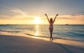 Beautiful young woman on the sandy beach at sunset Royalty Free Stock Photo