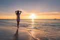 Beautiful young woman on the sandy beach at sunset Royalty Free Stock Photo