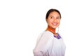 Beautiful young woman standing wearing traditional andean blouse and red necklace, turning head looking towards camera Royalty Free Stock Photo