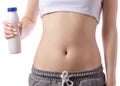 Beautiful young woman stomach belly bottle of yogurt Royalty Free Stock Photo