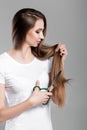 Woman with long hair holds scissors Royalty Free Stock Photo