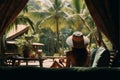 Beautiful young woman in straw hat enjoying a relaxing vacation on a tropical beach by the sea Royalty Free Stock Photo