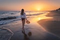 Beautiful woman with straw hat is standing in sea with waves Royalty Free Stock Photo