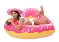 Beautiful young woman in stylish bikini with cocktail and inflatable ring Royalty Free Stock Photo