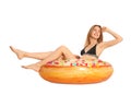 Beautiful young woman in stylish bikini with doughnut inflatable ring on white Royalty Free Stock Photo