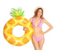 Beautiful young woman in stylish bikini with pineapple inflatable ring Royalty Free Stock Photo