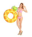 Beautiful young woman in stylish bikini with pineapple inflatable ring Royalty Free Stock Photo