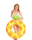 Beautiful young woman in stylish bikini with pineapple inflatable ring on white Royalty Free Stock Photo