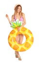 Beautiful young woman in stylish bikini with pineapple inflatable ring on white Royalty Free Stock Photo