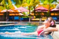 Beautiful young woman in sunglasses in luxury spa pool Royalty Free Stock Photo